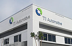 ป้ายชื่อสแตนเลสเงาหน้าอาคารสำนักงาน TI AUTOMOTIVE ระยอง